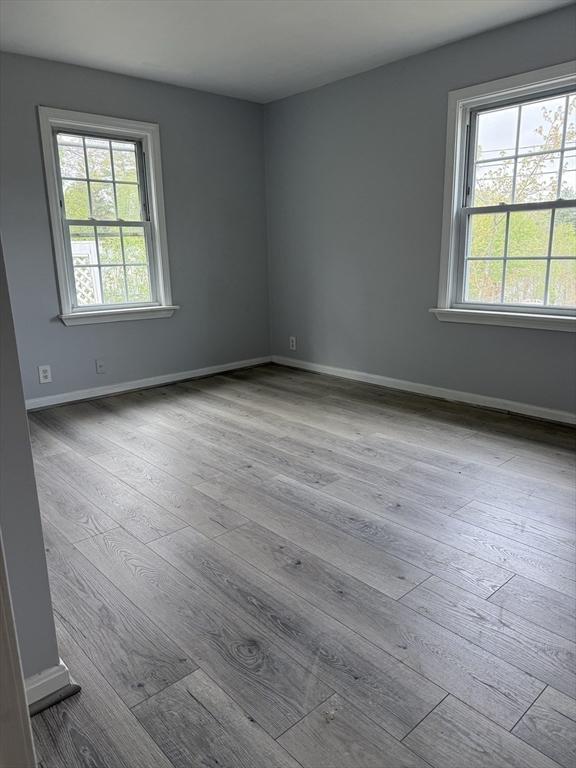 796 Charlton St, Southbridge, MA 01550 - unfurnished room with wood finished floors, healthy amount of natural light, and baseboards