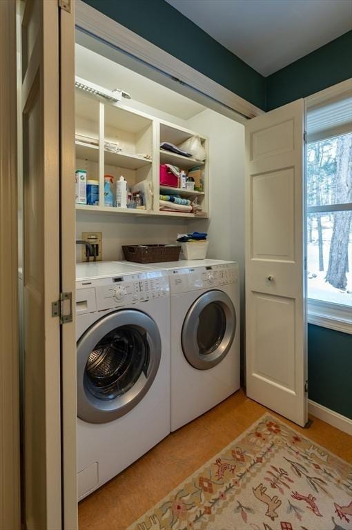 washroom with washing machine and dryer