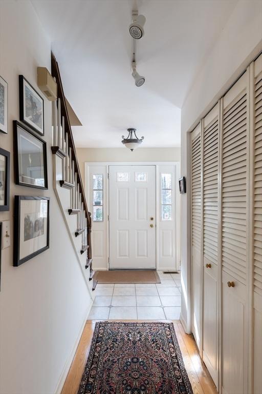 entrance foyer featuring plenty of natural light and light wood-type flooring