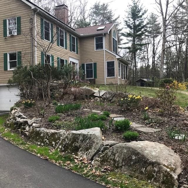 view of side of property featuring a garage