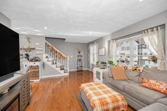 15 Alton St Unit 16, Lowell, MA 01852 - living area featuring stairs, light wood-type flooring, recessed lighting, and baseboards