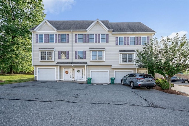 15 Alton St Unit 16, Lowell, MA 01852 - view of property featuring driveway and an attached garage