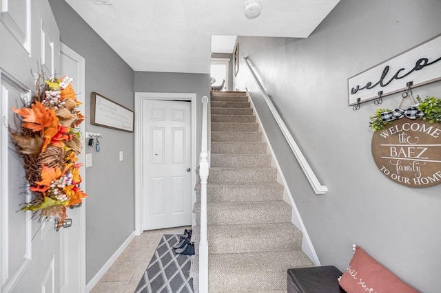 15 Alton St Unit 16, Lowell, MA 01852 - stairs with baseboards and tile patterned floors