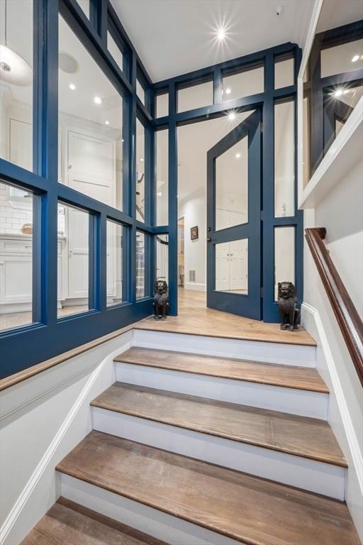 staircase with wood-type flooring