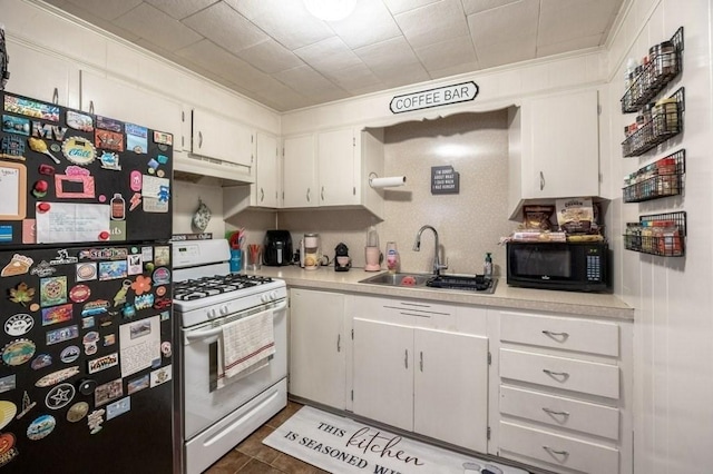 338-340 Main St, Fairhaven, MA 02719 - kitchen featuring black appliances, under cabinet range hood, light countertops, white cabinets, and crown molding