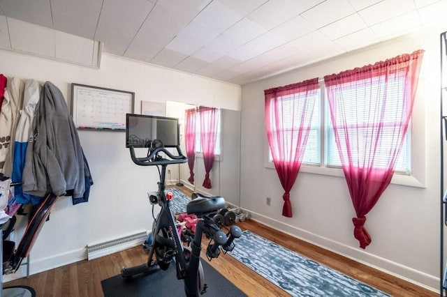 338-340 Main St, Fairhaven, MA 02719 - workout room featuring wood finished floors and a baseboard heating unit