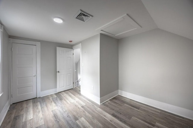 338-340 Main St, Fairhaven, MA 02719 - unfurnished bedroom featuring wood finished floors and lofted ceiling