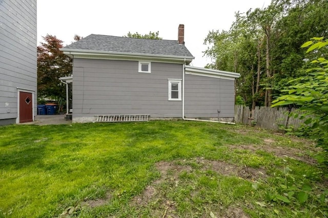 338-340 Main St, Fairhaven, MA 02719 - back of property featuring a chimney and roof with shingles