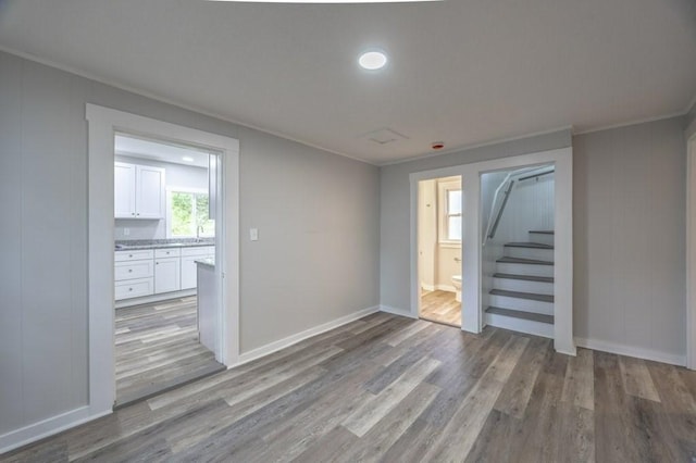 338-340 Main St, Fairhaven, MA 02719 - empty room with stairway, wood finished floors, and crown molding