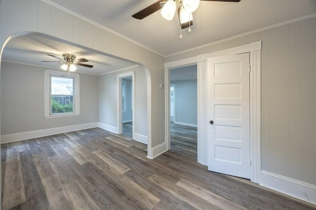 338-340 Main St, Fairhaven, MA 02719 - unfurnished room featuring ceiling fan, arched walkways, dark wood finished floors, and crown molding