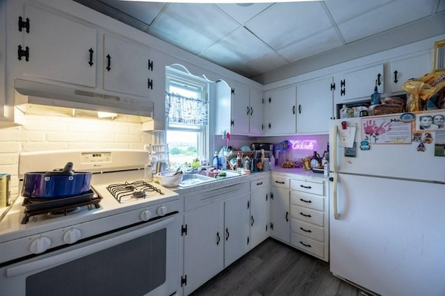 338-340 Main St, Fairhaven, MA 02719 - kitchen with white appliances, under cabinet range hood, white cabinetry, dark wood-style floors, and light countertops