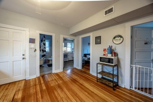338-340 Main St, Fairhaven, MA 02719 - entryway with wood-type flooring and baseboards