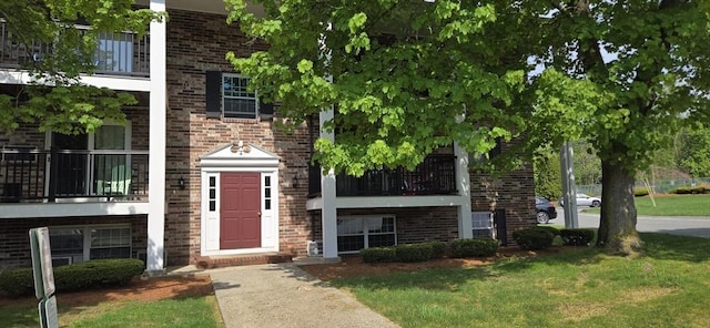 4 Walker Rd Unit 2, North Andover, MA 01845 - view of front facade with brick siding and a front lawn