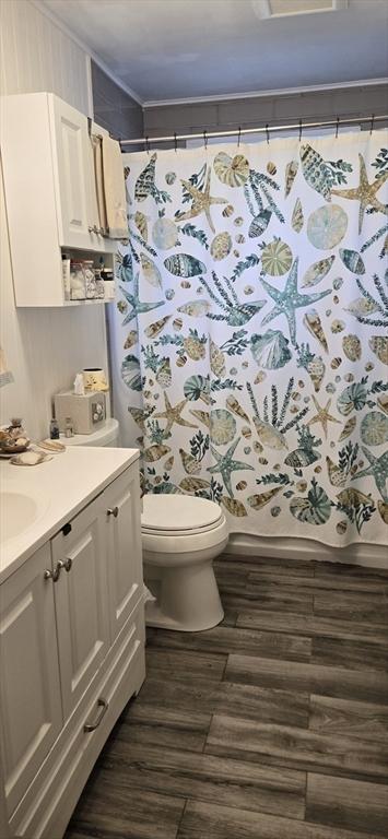4 Walker Rd Unit 2, North Andover, MA 01845 - full bath featuring crown molding, wood finished floors, toilet, and vanity