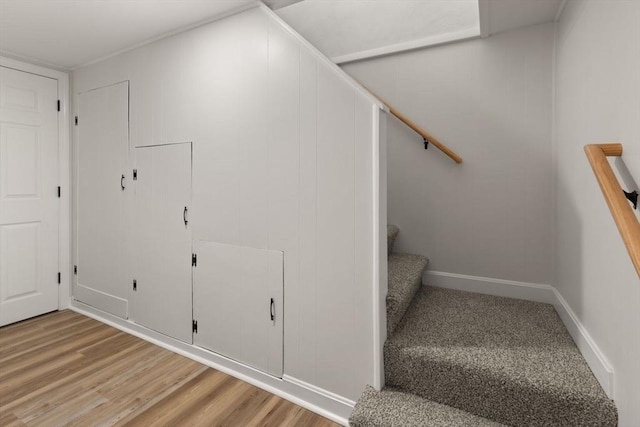 stairway featuring hardwood / wood-style flooring