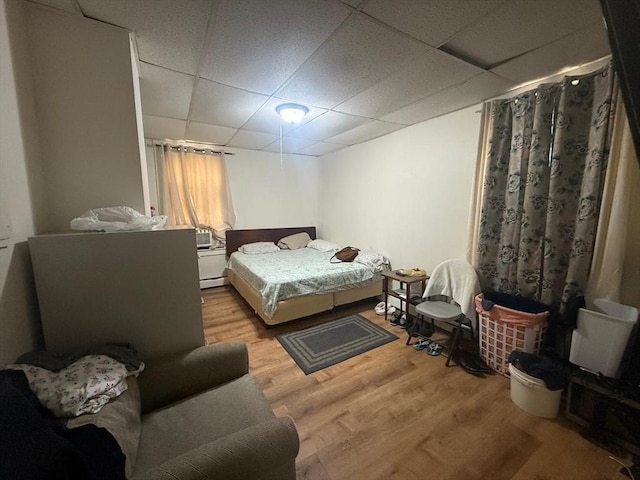91 Summer St Unit 3, Lawrence, MA 01840 - bedroom featuring a drop ceiling, wood finished floors, and baseboard heating