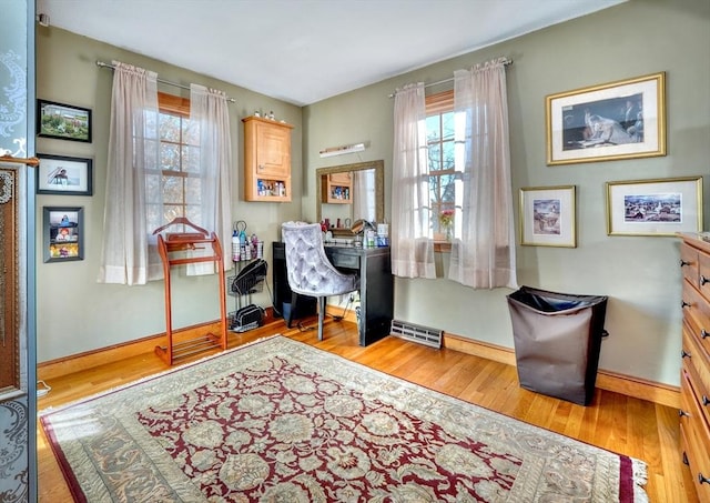 office area with light hardwood / wood-style floors