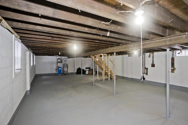 basement with plenty of natural light and water heater