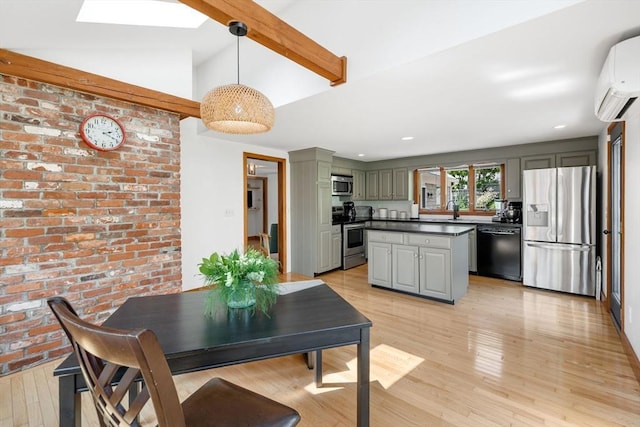 6 Paddock Dr, Harwich, MA 02645 - dining room featuring a wall mounted AC, light wood-style floors, beam ceiling, brick wall, and a skylight