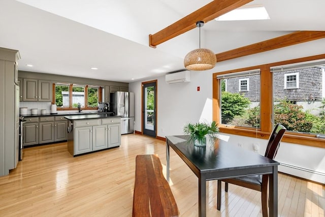 6 Paddock Dr, Harwich, MA 02645 - dining room with an AC wall unit, a baseboard heating unit, light wood-type flooring, recessed lighting, and a skylight