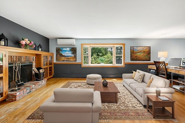 6 Paddock Dr, Harwich, MA 02645 - living room featuring a wall mounted AC, a brick fireplace, wood finished floors, and a baseboard radiator
