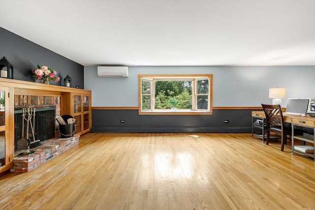 6 Paddock Dr, Harwich, MA 02645 - home office featuring a wall mounted AC, wood finished floors, a fireplace, and a wainscoted wall