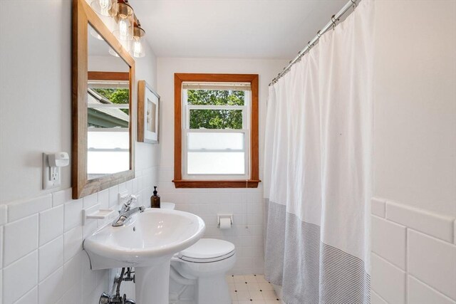 6 Paddock Dr, Harwich, MA 02645 - full bathroom featuring tile walls, wainscoting, and a shower with shower curtain