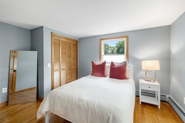6 Paddock Dr, Harwich, MA 02645 - bedroom featuring light wood-type flooring, a closet, and baseboard heating