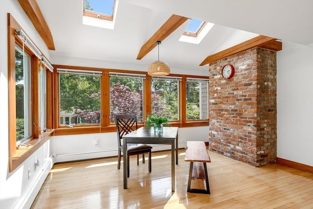 6 Paddock Dr, Harwich, MA 02645 - dining room featuring a skylight, light wood-style flooring, and a baseboard heating unit