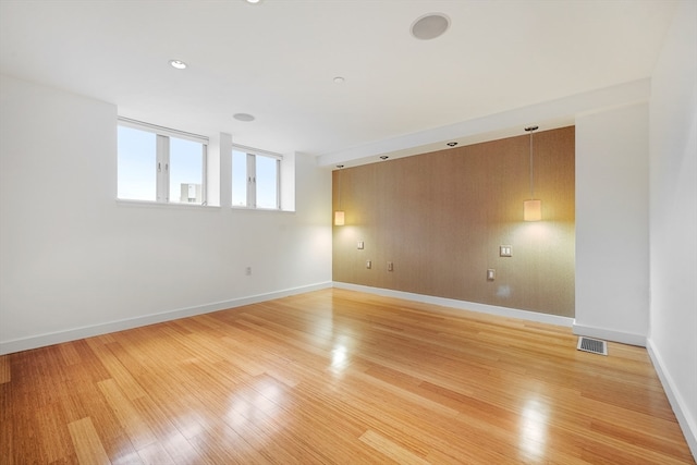 spare room with light hardwood / wood-style floors