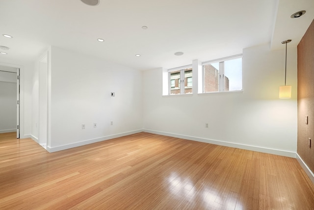 unfurnished room with light hardwood / wood-style flooring