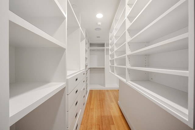 spacious closet featuring light wood-type flooring