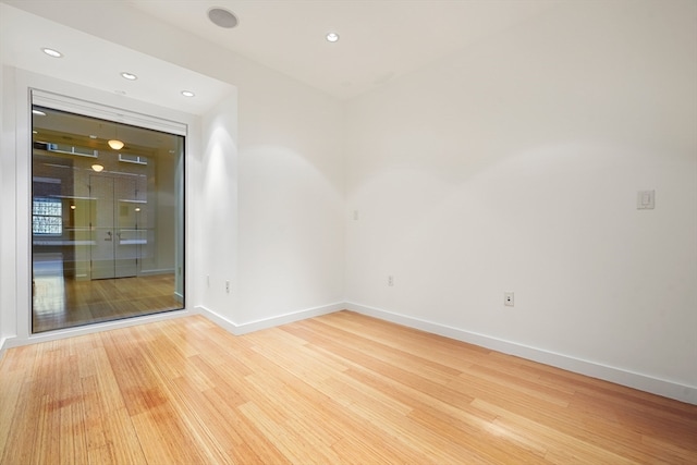 unfurnished room featuring light wood-type flooring