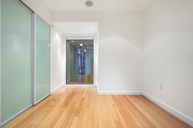 spare room featuring light hardwood / wood-style floors