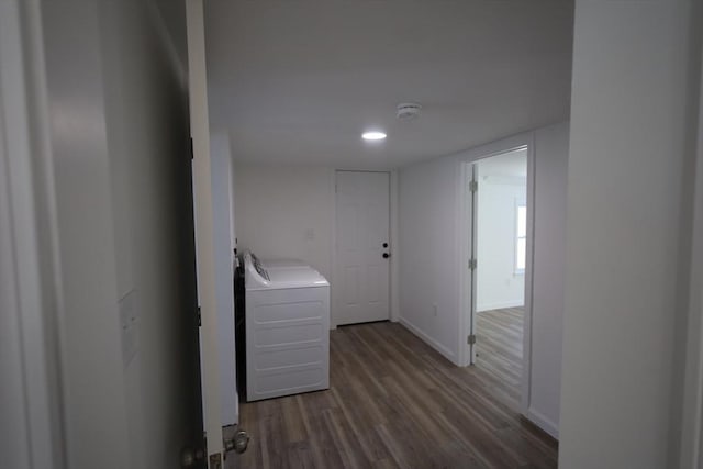 laundry area with washer / dryer and dark hardwood / wood-style flooring