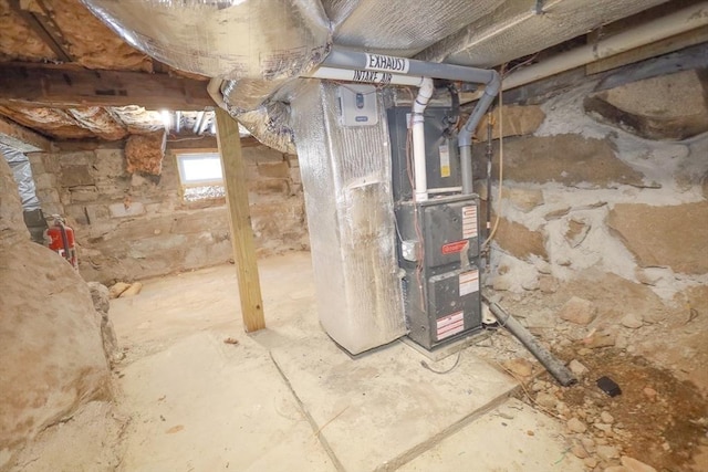 utility room featuring heating unit