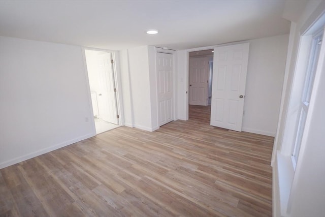 unfurnished bedroom with light hardwood / wood-style floors