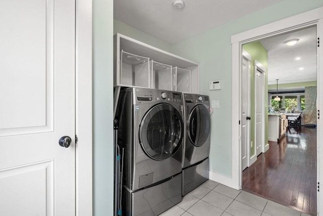 40 Tall Pine Dr Unit 18, Sudbury, MA 01776 - laundry area with washer and dryer and tile patterned flooring
