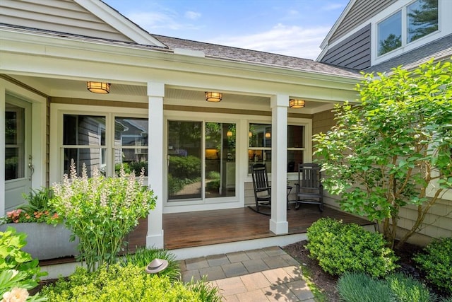 40 Tall Pine Dr Unit 18, Sudbury, MA 01776 - view of exterior entry with a porch and roof with shingles