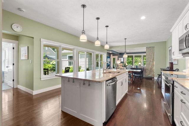 40 Tall Pine Dr Unit 18, Sudbury, MA 01776 - kitchen featuring appliances with stainless steel finishes, dark wood-style flooring, an island with sink, white cabinets, and recessed lighting