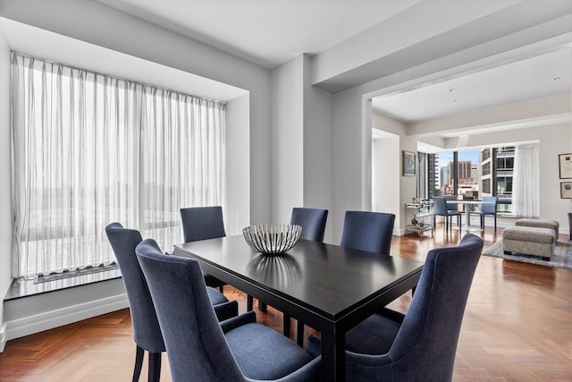 dining room with light parquet flooring