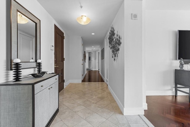 corridor featuring light tile patterned floors