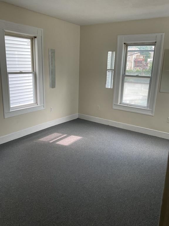 45 Judson St, Boston, MA 02125 - spare room with baseboards and dark carpet