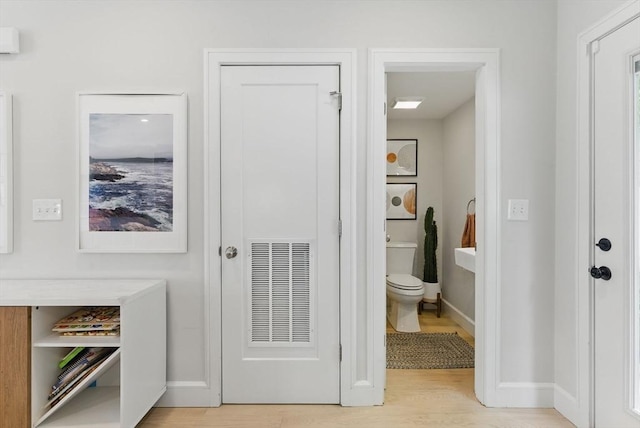 54-58 Robey St Unit 54, Boston, MA 02119 - interior space featuring toilet, wood finished floors, and baseboards