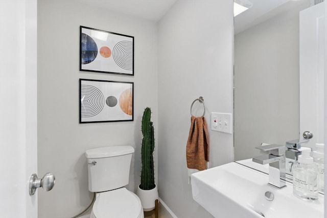 54-58 Robey St Unit 54, Boston, MA 02119 - half bathroom with toilet, a sink, and baseboards