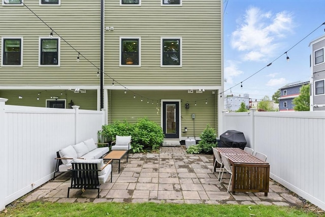 54-58 Robey St Unit 54, Boston, MA 02119 - back of property with a patio, a fenced backyard, and outdoor lounge area