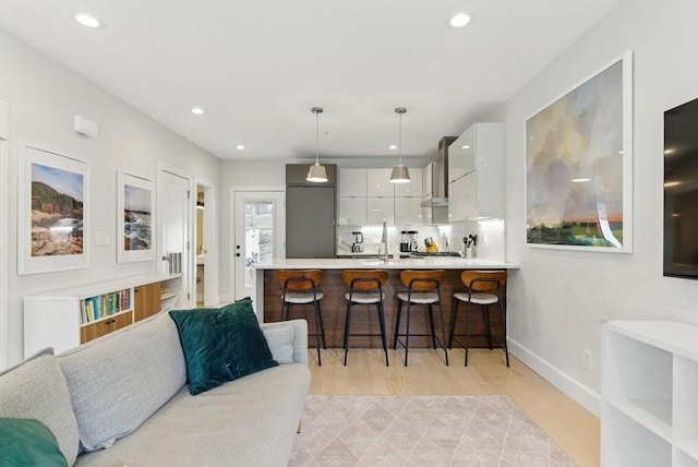 54-58 Robey St Unit 54, Boston, MA 02119 - kitchen featuring modern cabinets, a kitchen breakfast bar, light countertops, white cabinetry, and a peninsula