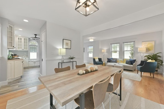 dining area with light wood-type flooring, plenty of natural light, and recessed lighting