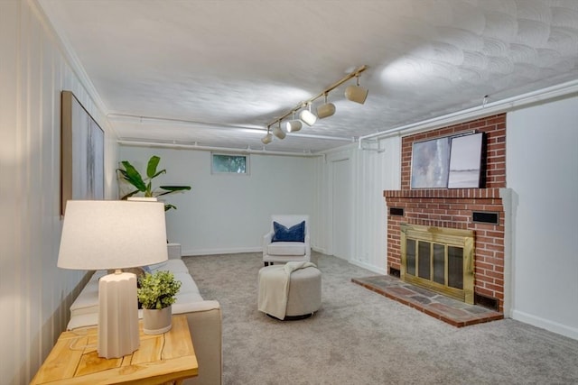 carpeted living area featuring a brick fireplace and baseboards