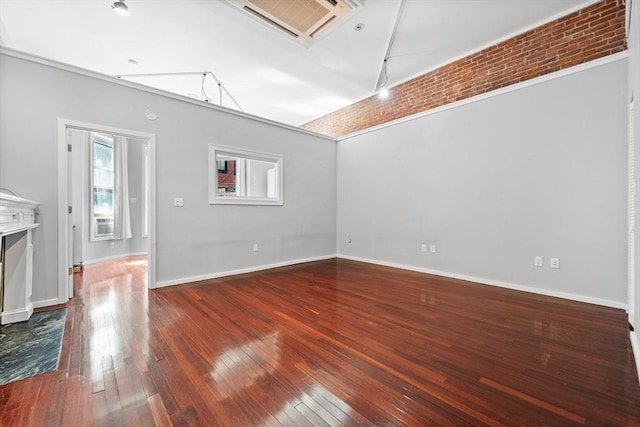 interior space featuring baseboards, cooling unit, dark wood-style floors, and visible vents